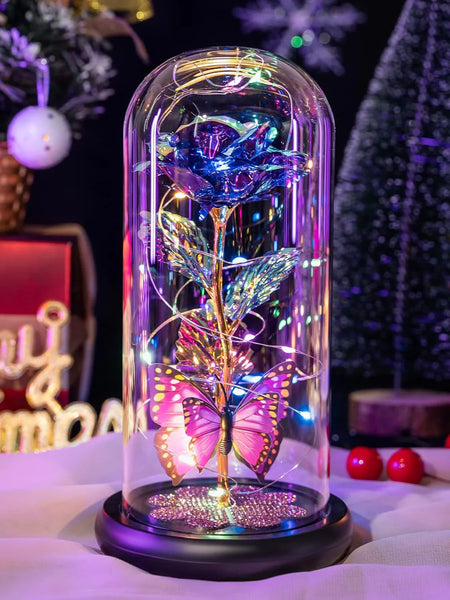 galaxy rose in glass dome with butterfly, on table