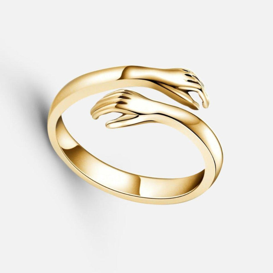 Hug Ring Gold -  gold on grey background