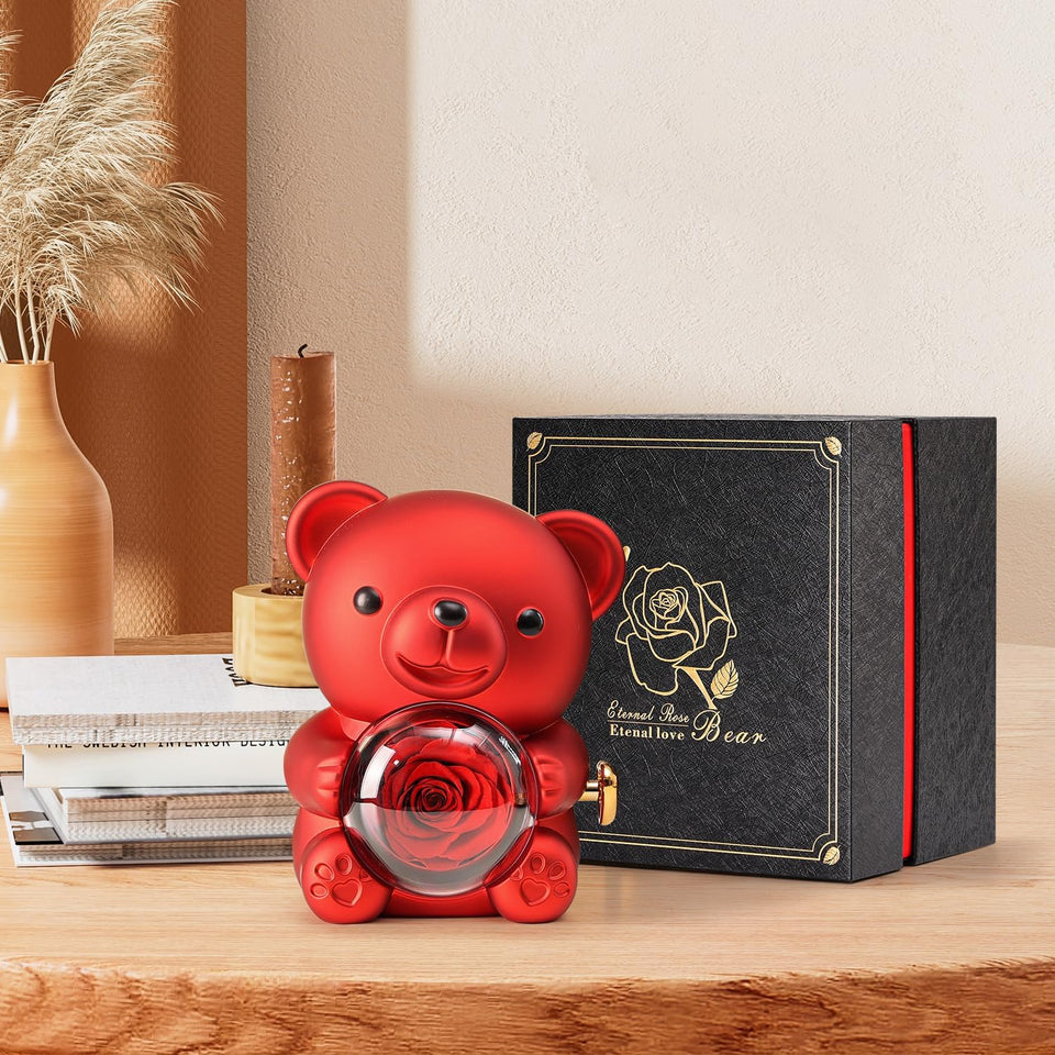 the preserved rose bear box sitting on a table alongside the giftbox it comes in