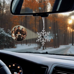 Person about to put their personalized photo snowflake ornament on their christmas tree